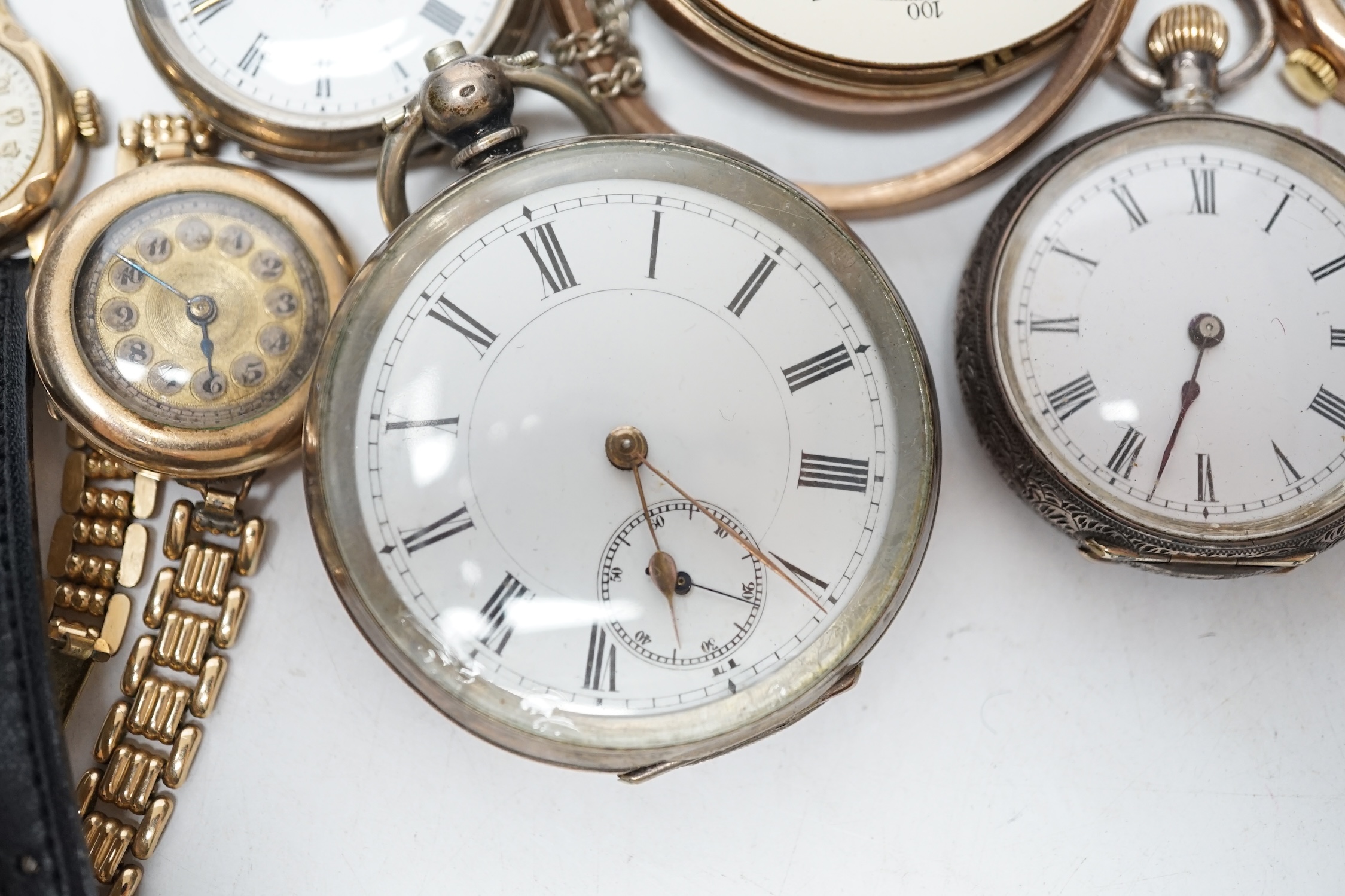 Two lady's 9ct gold manual wind wrist watches on gold plated straps, a gold plated wrist watch, two fob watches and two pocket watches. Condition - poor to fair